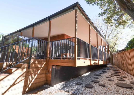 a house with a black railing