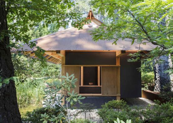 a small building surrounded by trees