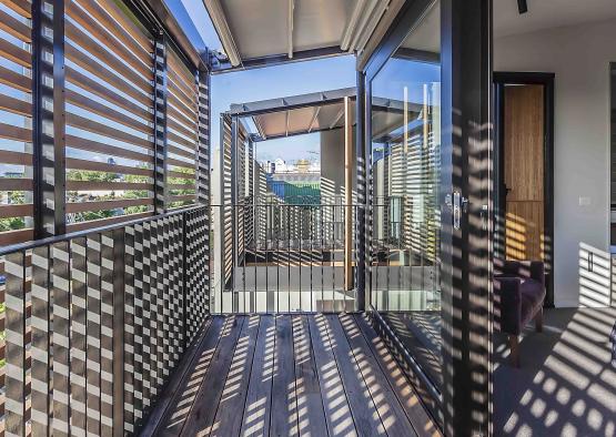 a balcony with a metal railing