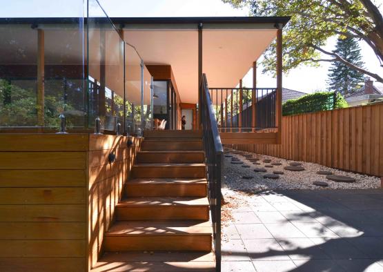 a wooden stairs leading to a house