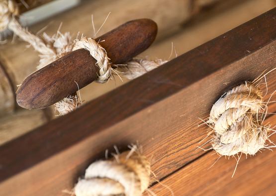 a rope tied around a wooden beam