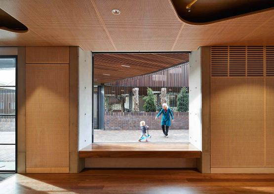 an old woman and a child walking through a window