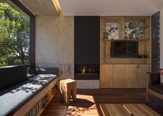 a room with a fireplace and a bench