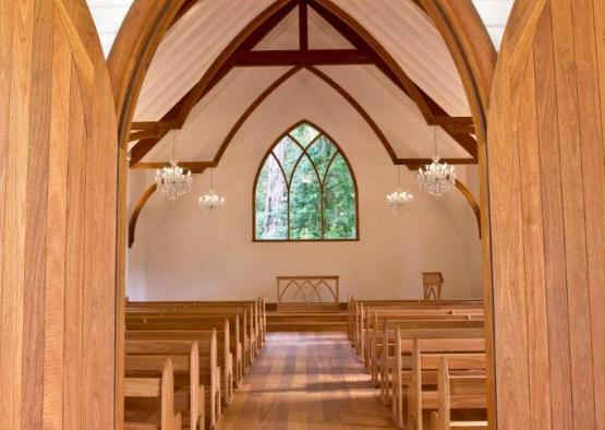 a church with wooden floor and wooden ceiling