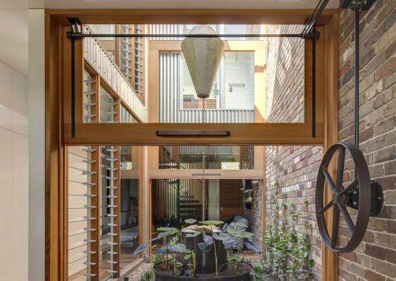 a brick courtyard with a light fixture