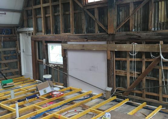 a room with wooden beams and a window