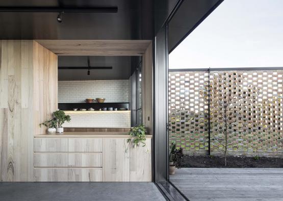 a room with a wood counter and a wood deck