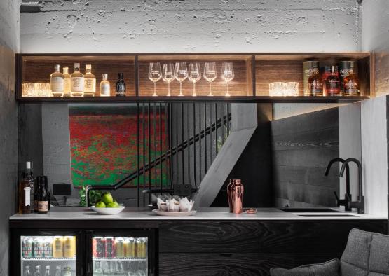 a bar with shelves and bottles of wine