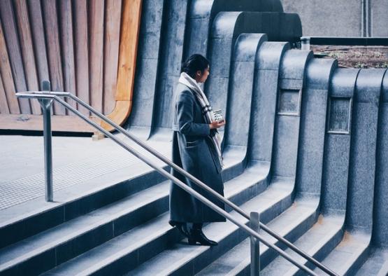 a woman standing on a set of stairs