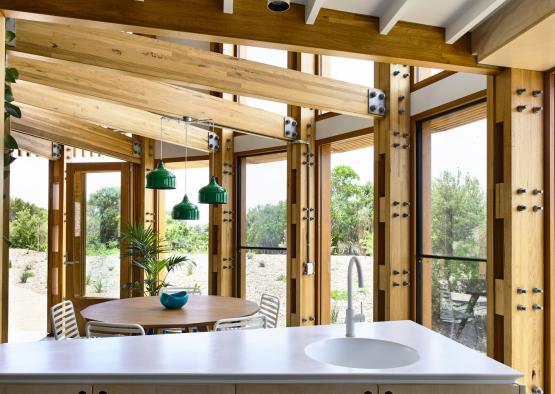 a kitchen with a table and chairs