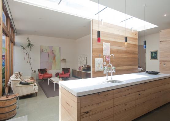 a kitchen with a large island and a large window