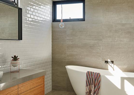 a bathroom with a tub and sink