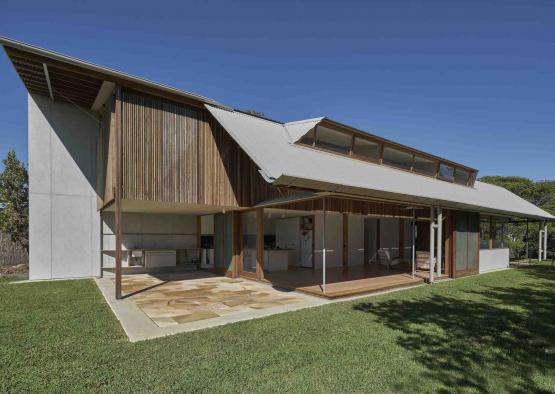 a house with a patio and grass