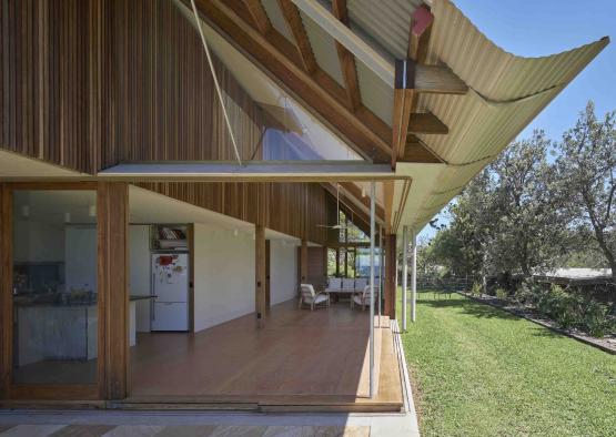 a house with a roof and grass