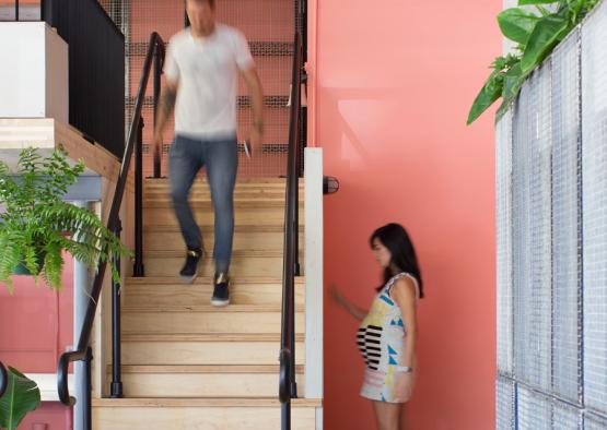 a man and woman walking up stairs