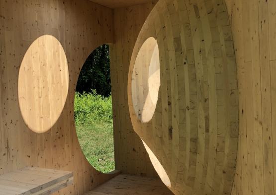 a wooden room with round windows