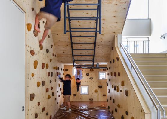 a kids climbing on a rock wall