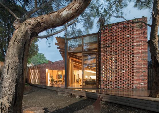 a brick house with a glass door