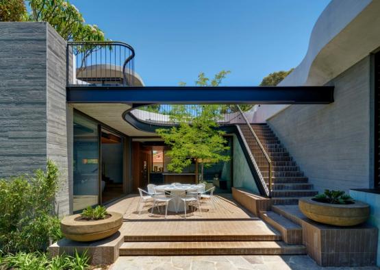 a patio with a table and chairs