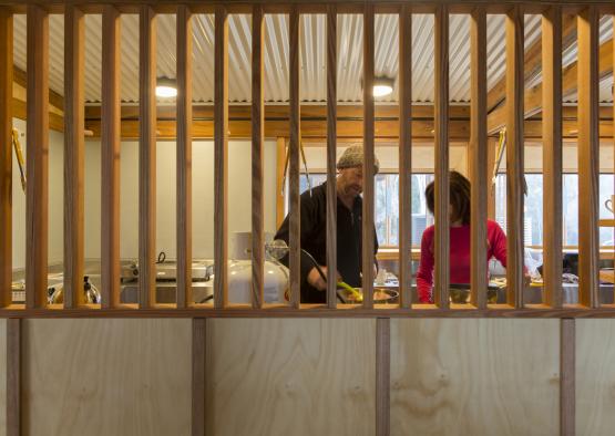 a man and woman cooking in a kitchen