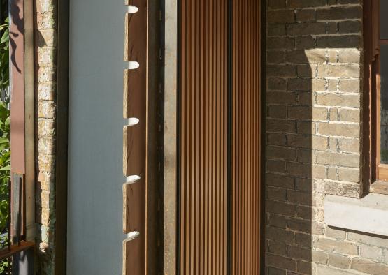 a brick building with a wood door