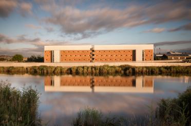 a building next to a body of water