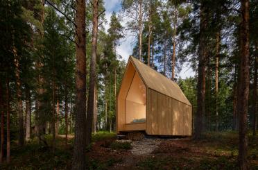 a small wooden cabin in the woods