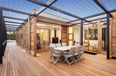 a patio with a table and chairs