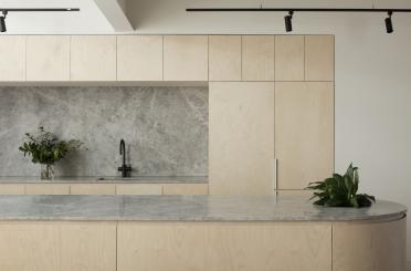 a kitchen with a marble countertop