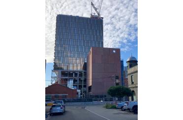 a building under construction with a crane