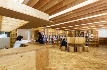 people in a library with a couple of people