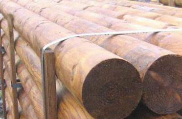 a stack of logs on a rack